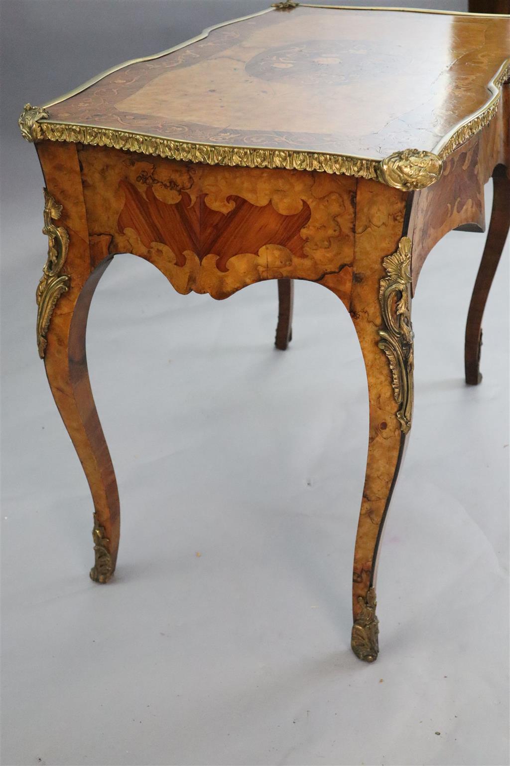 A late 19th century French ormolu mounted walnut, rosewood and marquetry writing table, W.3ft 1in. D.1ft 9in. H.2ft 6in.